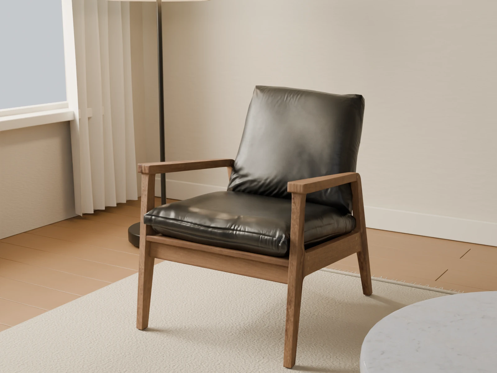 Close view of the oak frame and black leather upholstery of an armchair